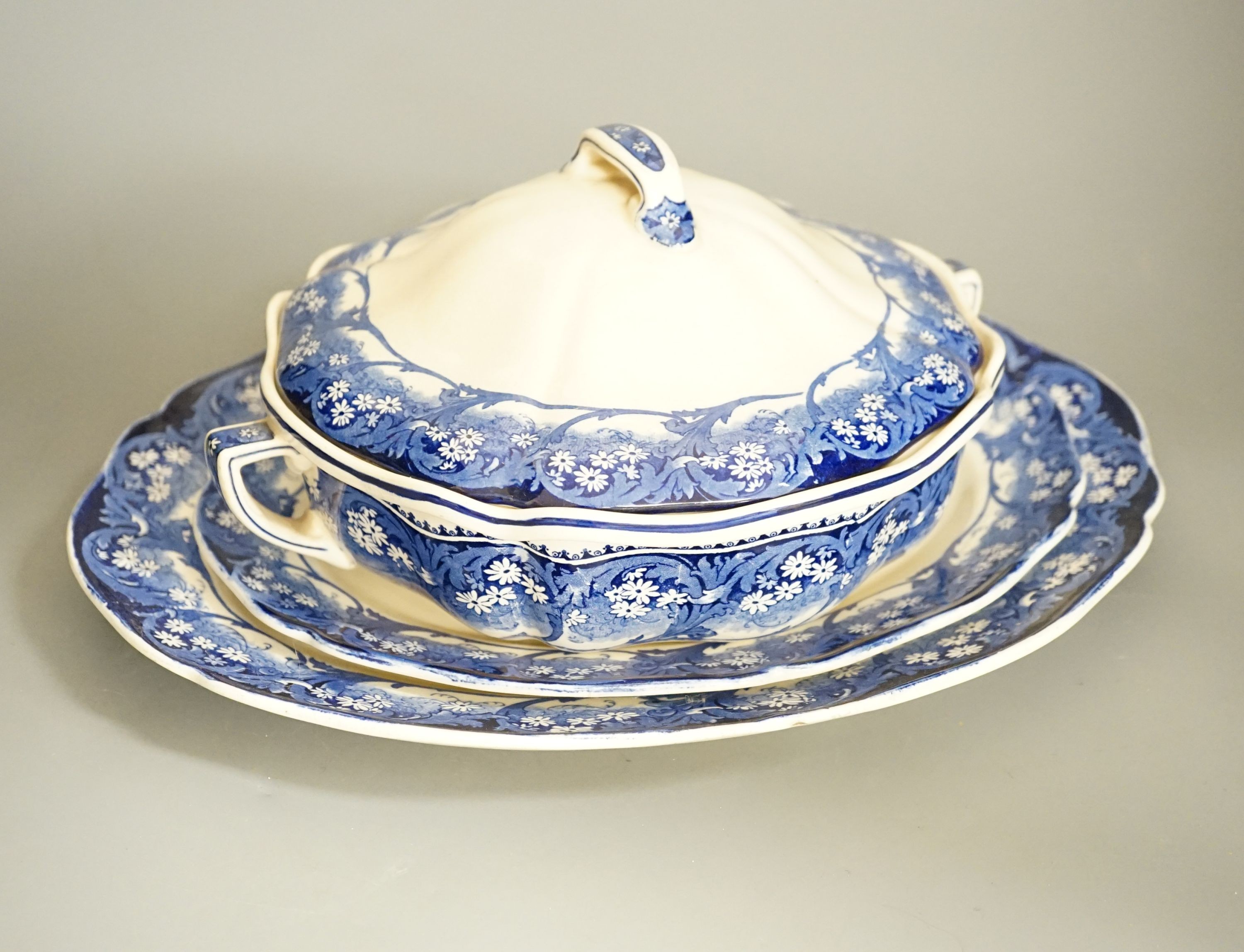 A Royal Doulton ‘Marjorie’ blue and white part dinner service and a Victorian jasper ware and electroplate mounted biscuit box, biscuit box, 17 cms high.